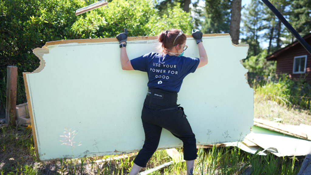 employee volunteering by restoring camp