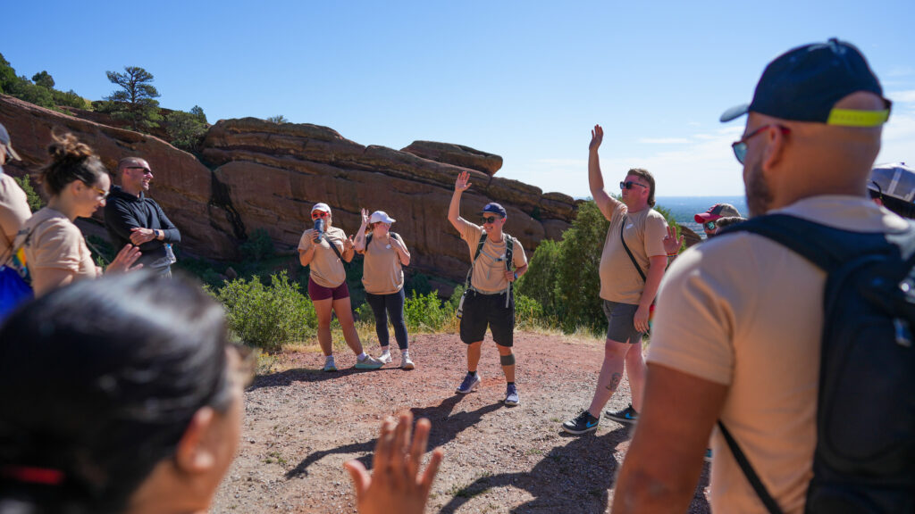 employees engaging in team building activity outside