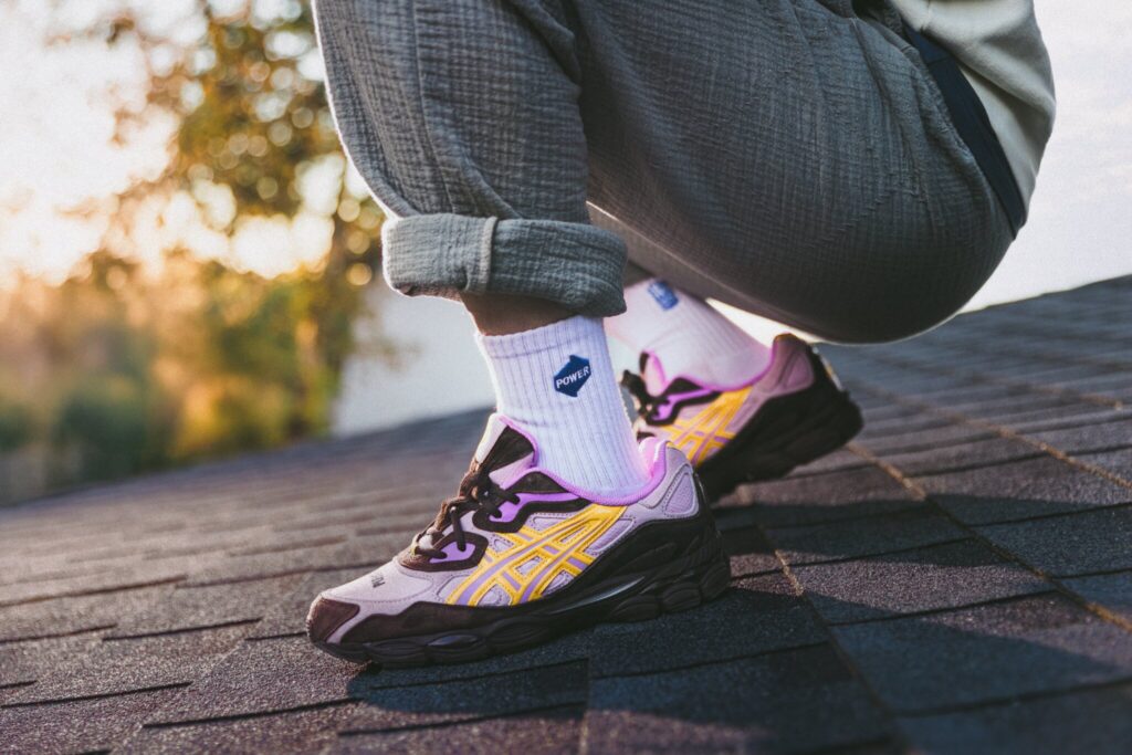 A close up of the POWER x Standard Issue branded white tube socks.