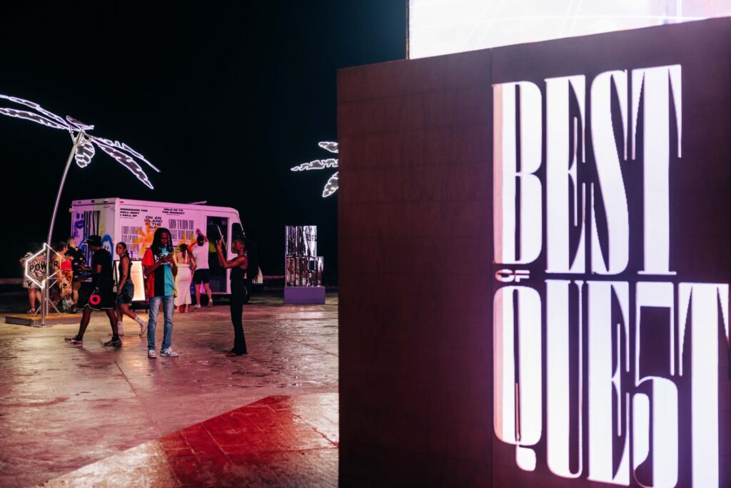 A "Best of Quest" light-up sign displayed at the event.