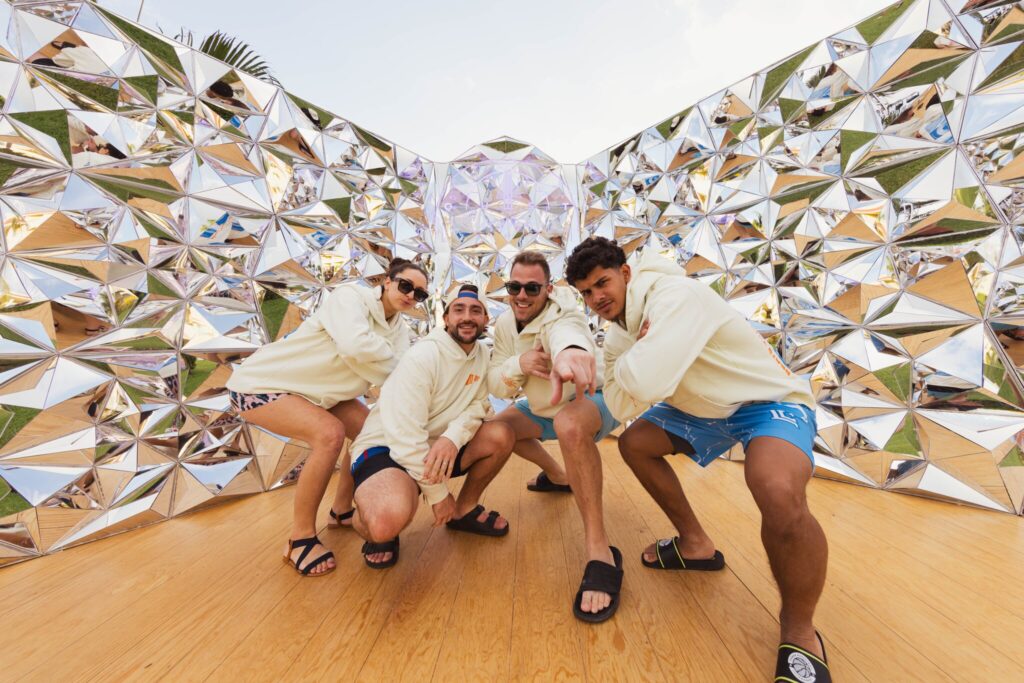 Employees pose for a photo in one of the Quest installations.