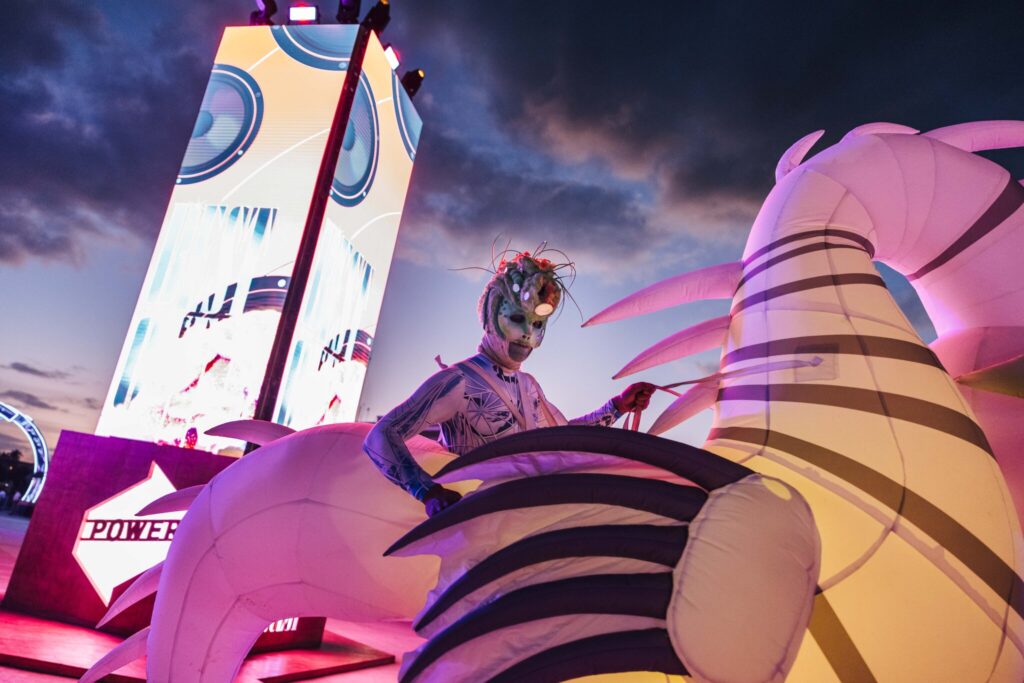 A performer hypes up the crowd during Quest.