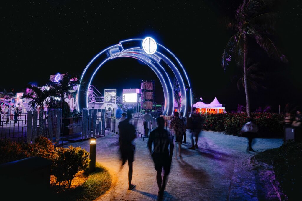 Quest attendees are welcomed in to the festival through the lit-up archways.
