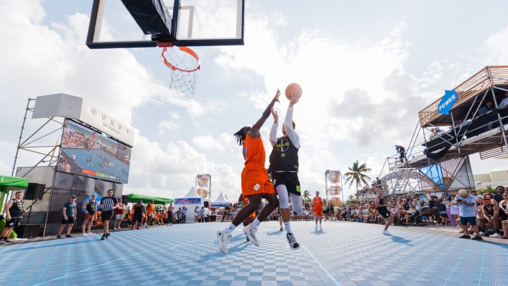 Two POWER employees face off during the Basketball tournament at Quest.