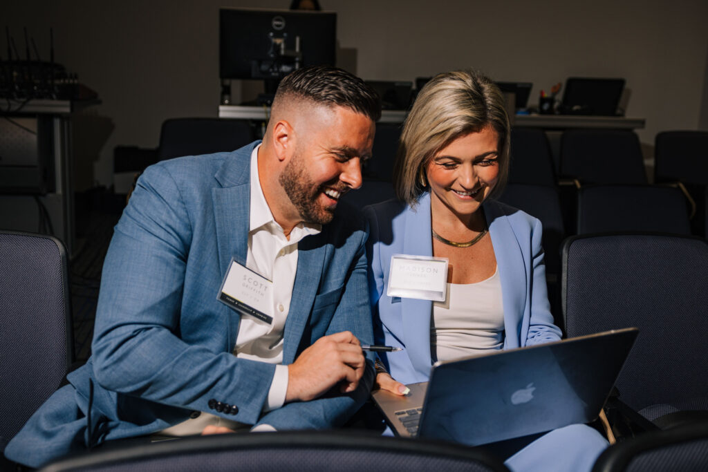 Two employees collaborating during a three-day advanced leadership program for Director and VP candidates.