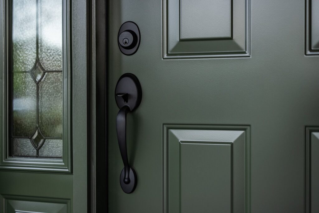 A matte black door handle on a POWER door.