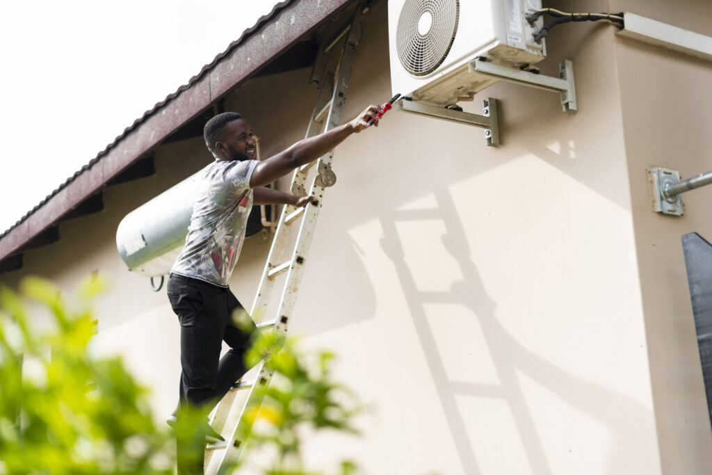 Man overreaching while on a ladder.