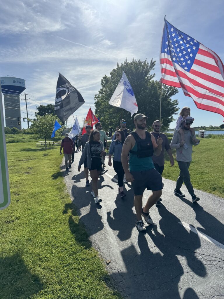 Power employees in Cincinnati march in a local park for the Memorial Day Ruck March.