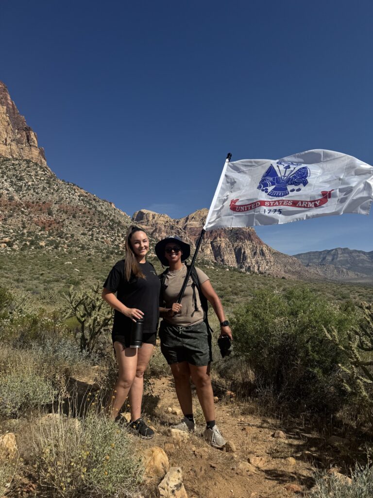 Two employees pose for photo in the Phoenix desert during Memorial Day Ruck March.
