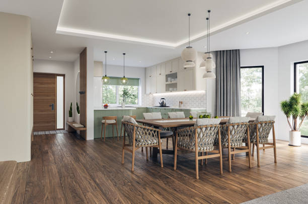 Open space living room and kitchen interior with large windows, TV wall, gray sofa, dining table and hardwood flooring. Modern design solution