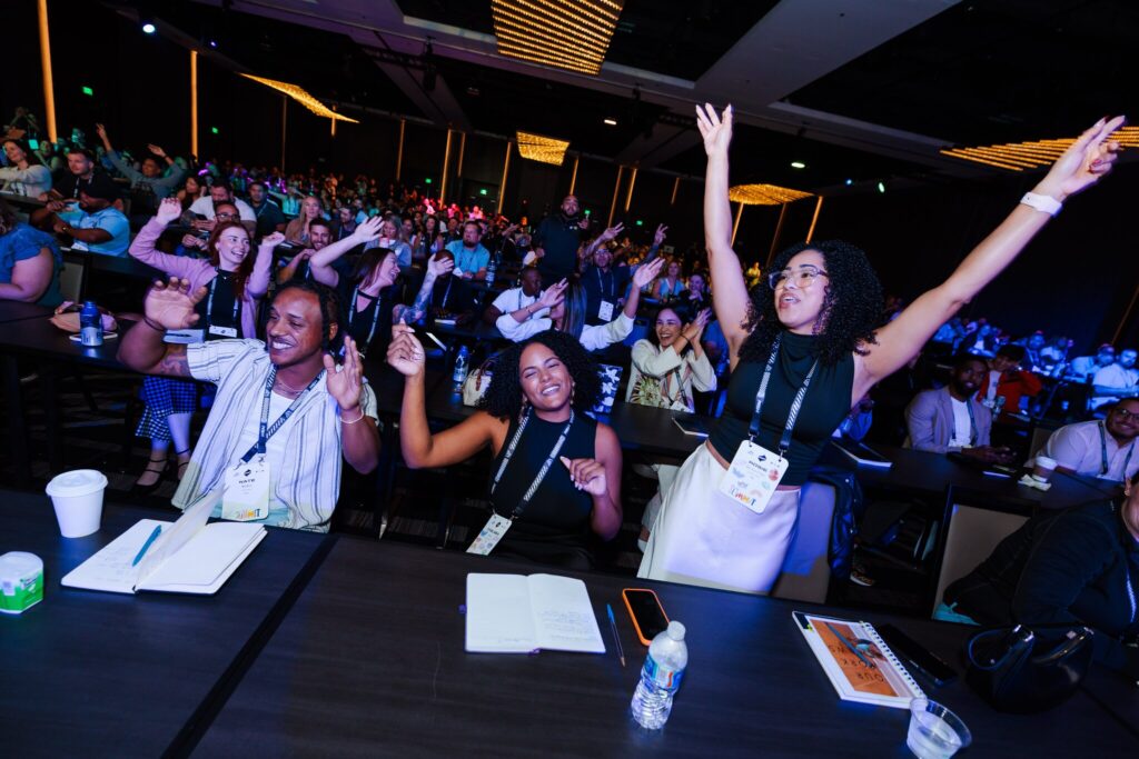 Employees celebrate and cheer together during POWER's DEI Summit.