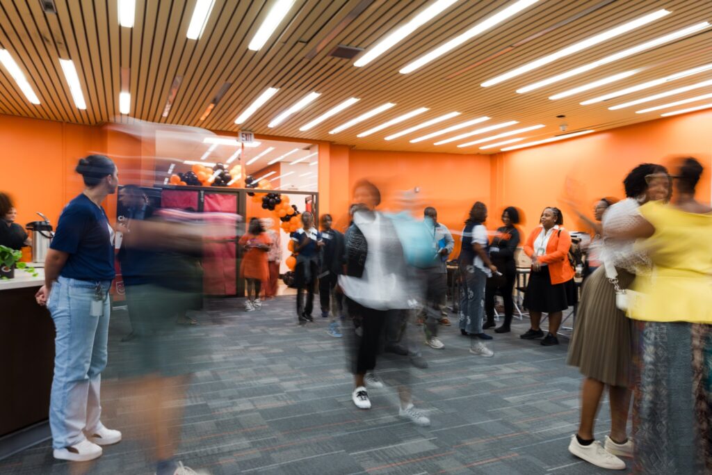 Crowds of people gather and tour the newly revitalized Chester High School library. 
