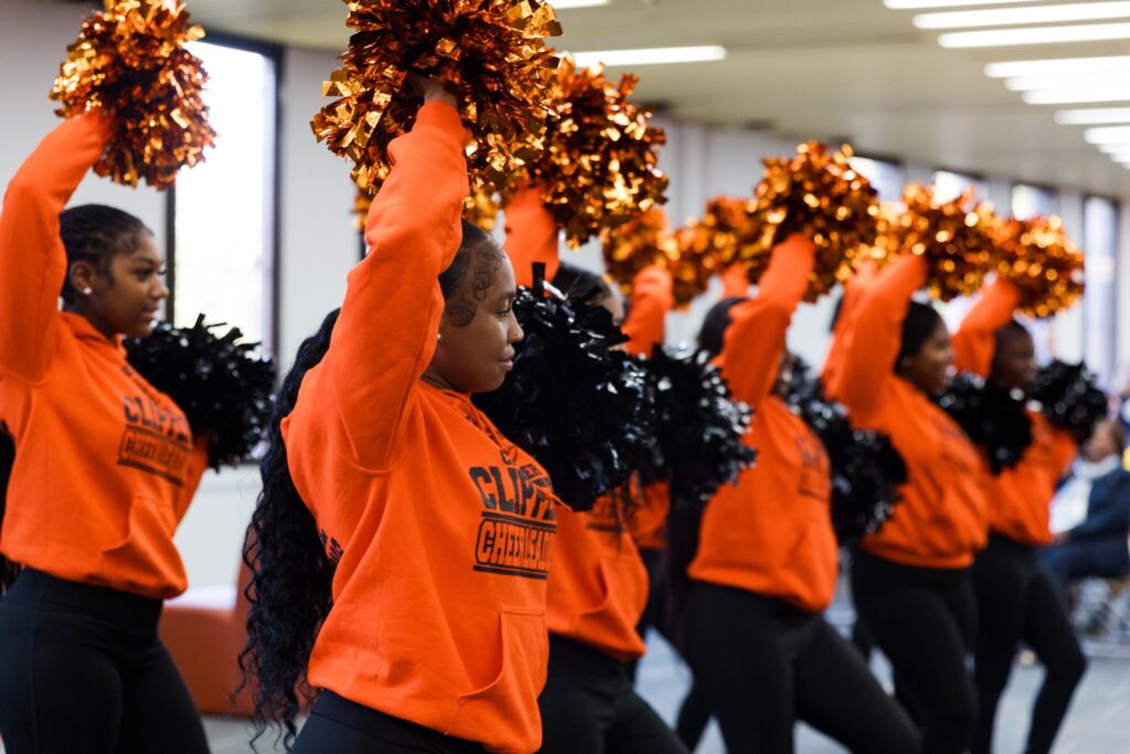 The Chester High School Cheerleaders deliver a performance during the library unveiling. 