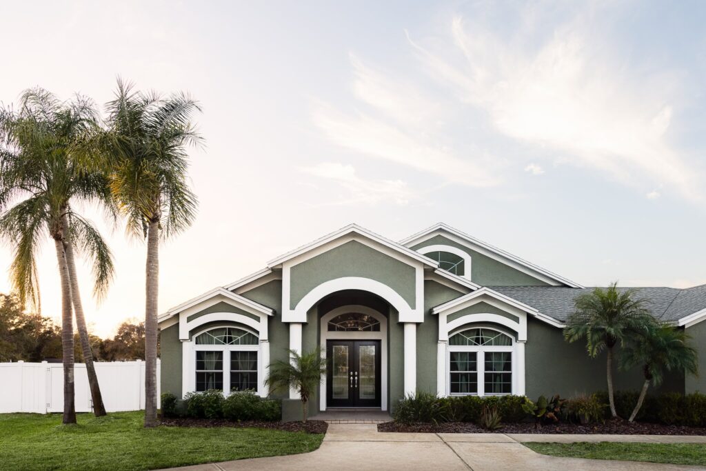Modern Tampa house with palm trees.